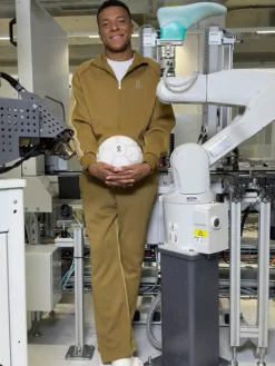 French Soccer Player Kylian Mbappe On Olive-Brown Fleece Tracksuit front view