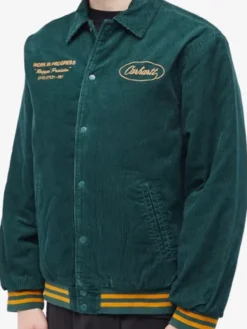 Close-up of Carhartt WIP Rugged Discovery Green & Buckthorn Letterman Corduory Jacket