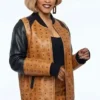 Close-up of Cleopatra Coleman TV-Series Nemesis S01 MCM Ebony Wilder Leather Brown Bomber Jacket