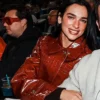 Close-up of Dua Lipa MLB New York Yankees vs Tampa Bay Rays Red Croc Leather Coat