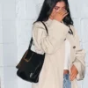 Close-up of Kylie Jenner Celeb Hotspot Sushi Park 2026 WeHo Beige Cotton Trench Coat