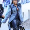 Close-up of Porsha Williams Schiaparelli Spring-Summer 2027 Paris Show Grey Faux Fur Jacket