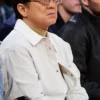 Close view of NBA China Game 2026 Houston Rockets vs Dallas Mavericks Jackie Chan White Cotton Jacket